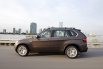2013 BMW X5 xDrive50i in Sparkling Bronze Metallic - Driving Left Side View